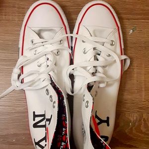 Brand NewUnisex white high top converse.
